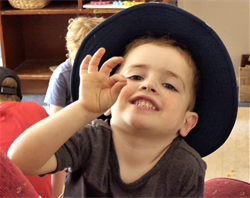 little.boy.hat.pinch.fingers_crop.png