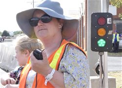 volunteer.walkie.talkie.lady.traffic.light.png