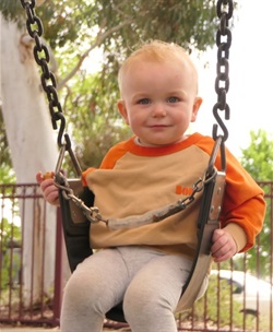 playspaces.grab.baby.swing.jpg