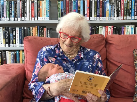 aged.aging.seniors.lady.reads.baby.engage.jpg